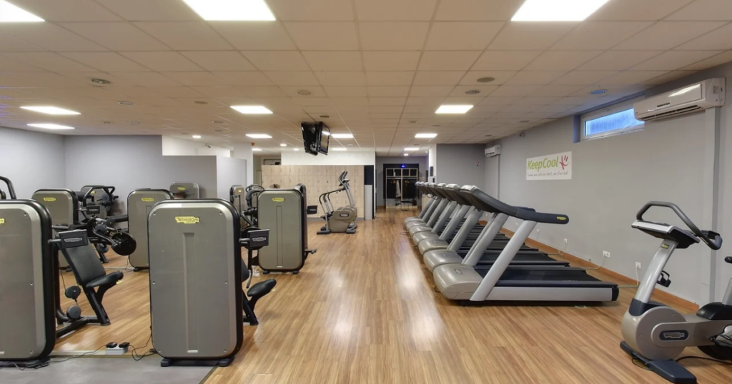 Gym amenities such as cardio machines, weights, locker room